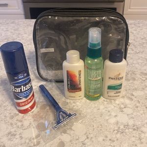 New travel bag with travel size shav. cream,disp razor,shampoo,cond.,shine spray